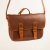 Handmade Morgan Messenger Bag in brown leather with adjustable strap against a white background. Leathercraft design by Vasile and Pavel.